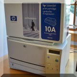 E08. HP Laserjet 2300 printer with print cartridges. - $100
